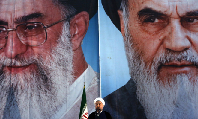 iranian-president-hassan-rouhani-speaks-in-front-of-portraits-of-iranrsquos-supreme-leader-left-andwarisrael