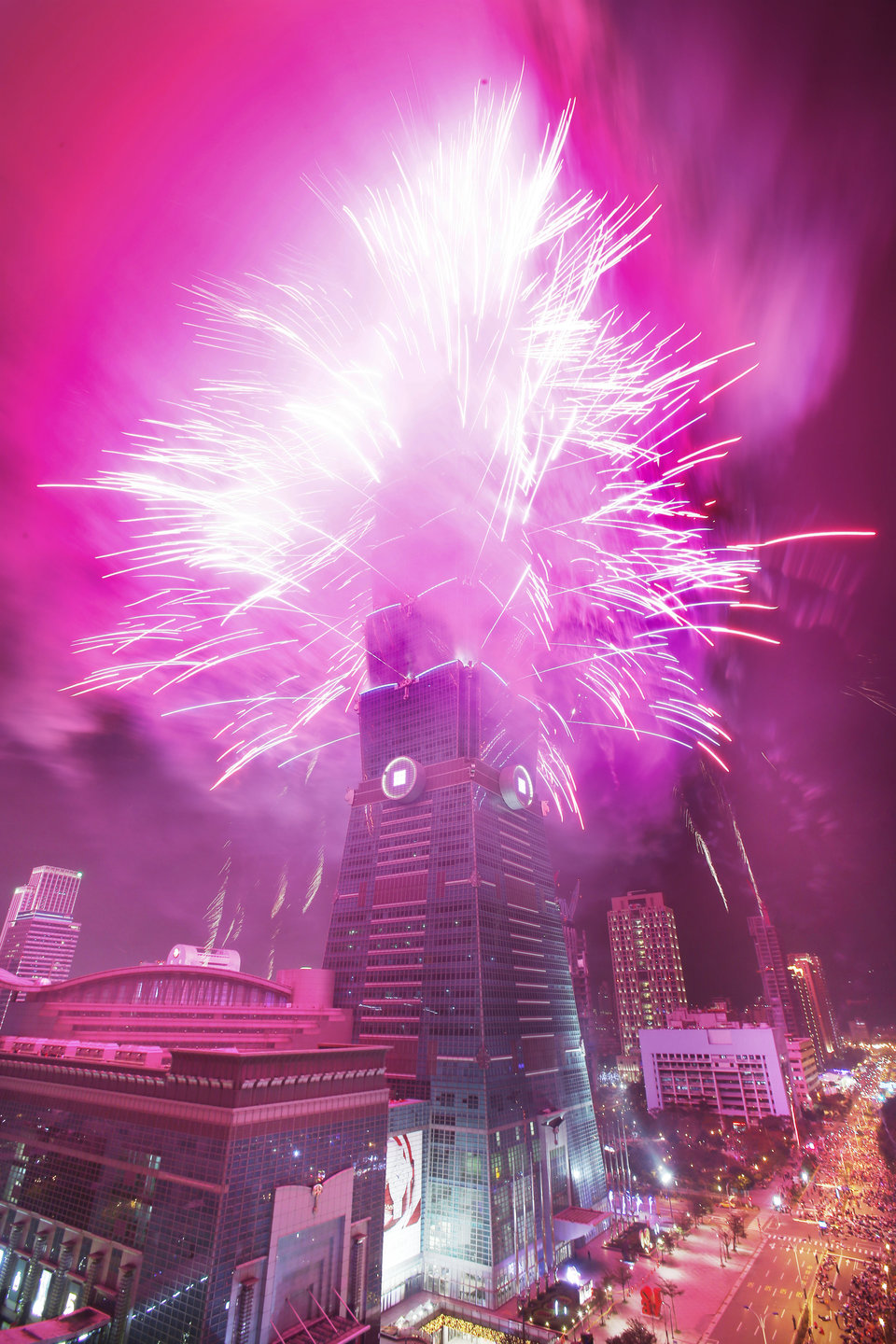A fireworks display is set off from the Taipei 101 skyscraper during the New Year's Eve celebrations in Taipei, Taiwan, Friday, Jan. 1, 2016. (AP Photo/Wally Santana)